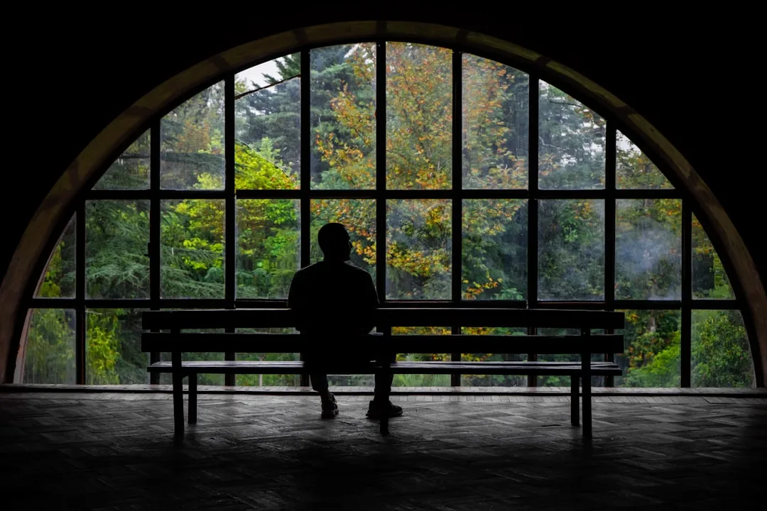 person reflecting on decisions alone