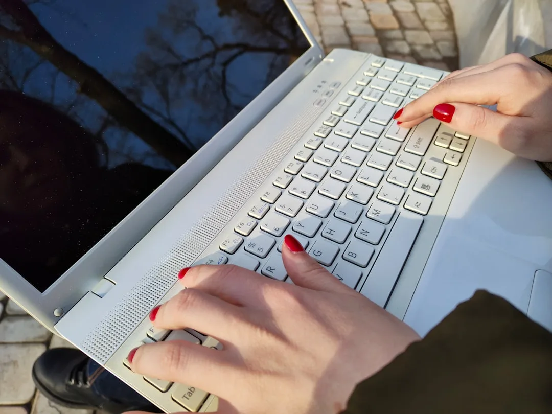 person organizing emails on laptop